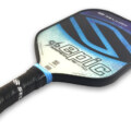 Selkirk's Amped Epic Pickleball Paddle, known for its innovation and performance. It features Selkirk's new Amped technology for a softer touch and enhanced control during gameplay. The paddle is empowered by unique X5 Fibre Fleck technology and a thicker profile for a plush hitting experience, skillfully balancing power and control. Visually, it boasts vibrant colors and stunning graphics, adding a stylish flair to its substantial functionality. The paddle is not just a game tool but a gamechanger in the world of pickleball.